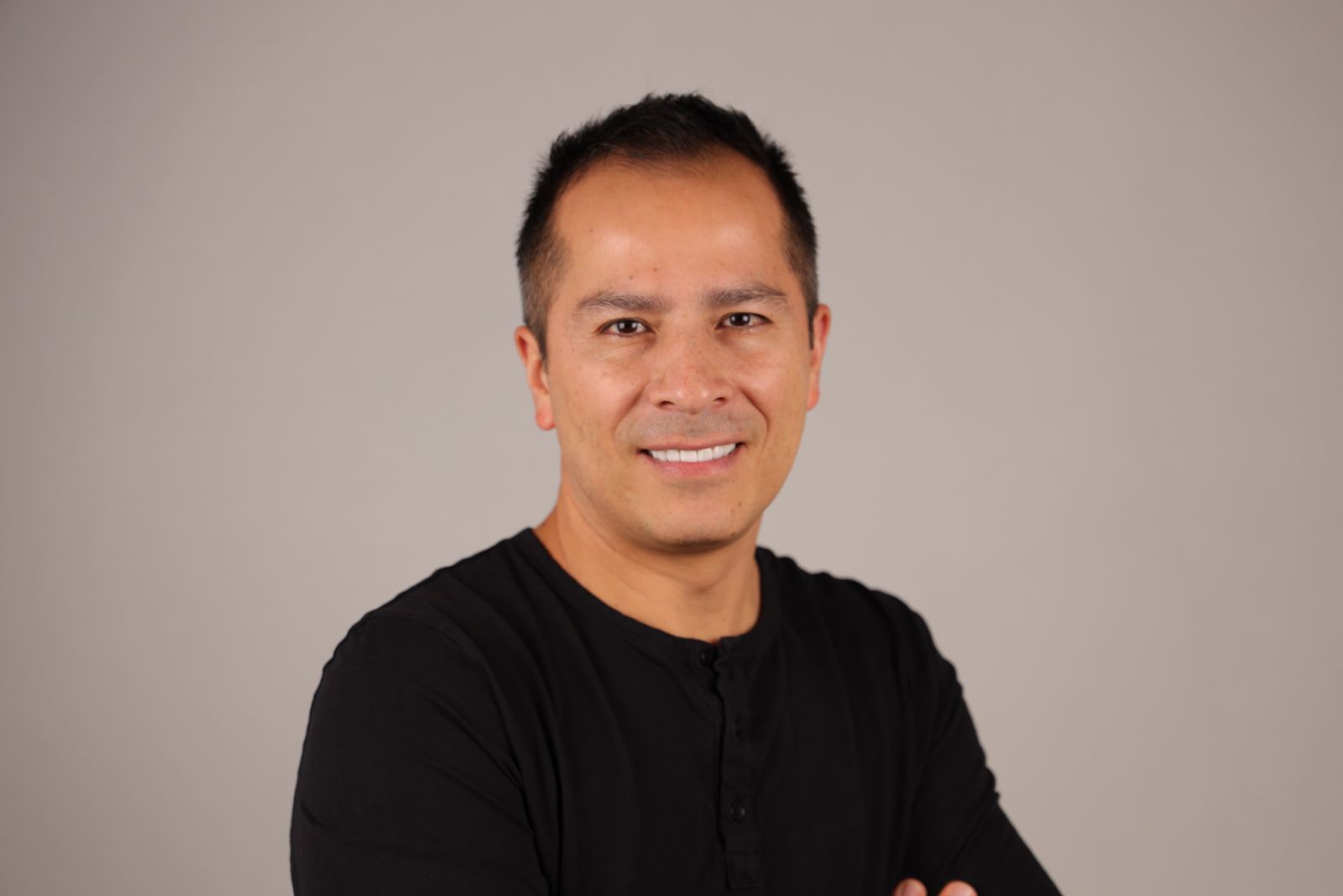 Dr. Edgar Castillo in medical scrubs